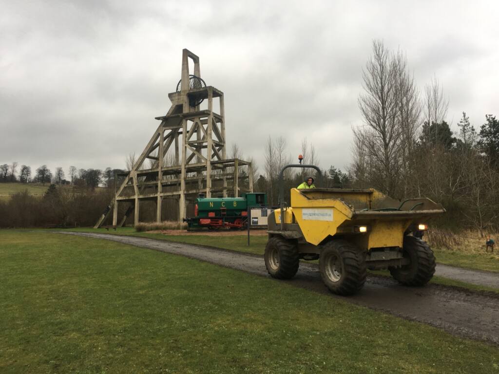 CRC driving an excavator on Lochore Meadows Country Park Mountain Bike Trail