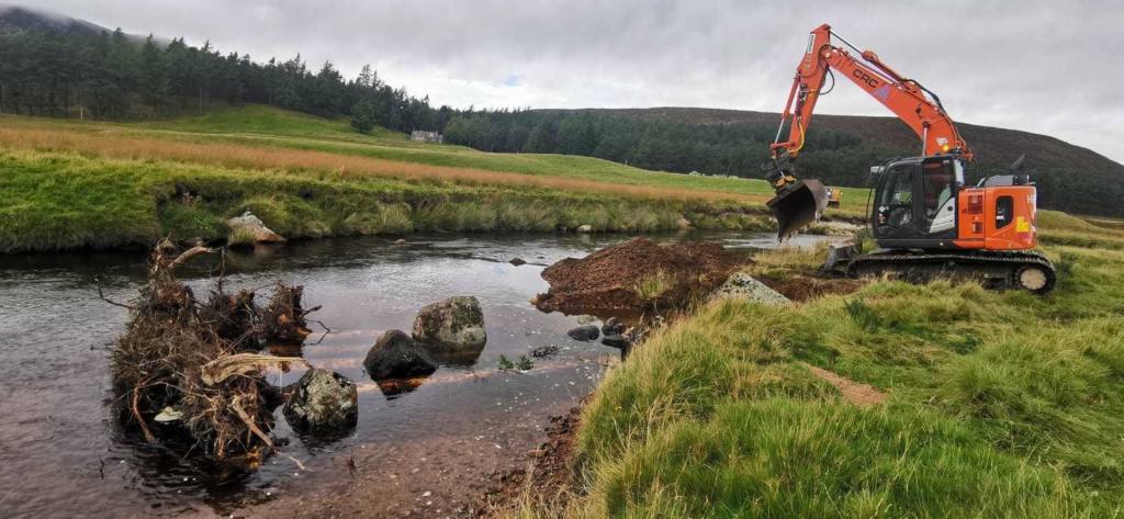 A CRC excavator working on a river bank